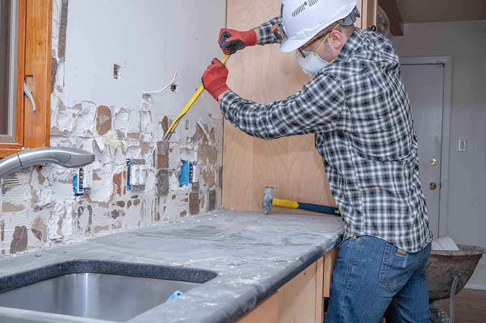 Kitchen tiling demolition in progress